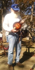 Mike Payne, Batesville, pauses from his mandolin concert to explain his instrument's heritage and the Scotch- Irish immigrants in Habersham. 