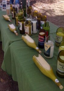 Bob and Diane Lampley, Clarkesville, take the used bottles from local wineries' tasting rooms and repurposes them into environmentally friendly candles. 