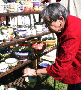 Anne Mayton of Clarkesville looks at pottery crafted by Polly Sherrill of Atlanta.