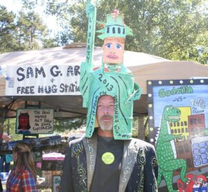 Folk artist Sam Granger of Lula models his "liberty" hat.