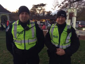 Clarkesville Police officers Danny Moulder (left) and Ryan Ledford came dressed as cops on the job. They helped keep the crowds safe as they walked along Washington Street in downtown Clarkesville.