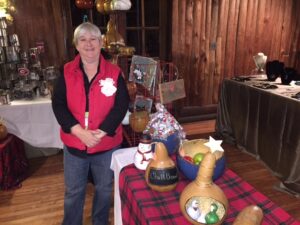 Robin Lovell sold handcrafted gourds and decorations. She enjoyed greeting customers and watching the kids.