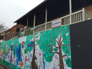 A graffiti wall blocks access to the row of historic, burned out buildings in Clarkesville.