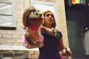 Cameron Scofield (Kate) performs "There's a Fine, Fine Line" in HCT's rehearsal for Avenue Q.