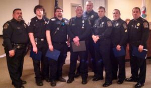 Seven Cornelia public safety officials were honored for their part in saving a man's life at Walmart on Nov. 27, 2014. They are (l-r): Sgt. Joe Pontes, Firefighter Bryan Nix, Firefighter Jared Nix, Officer Jeff Haslup, Officer Joel Matling, Lt. Kevin Marsteller, Sgt. Wayne Green and Maj. Jonathan Roberts