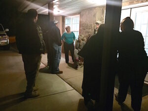  Crumley, center, stands with family and supporters outside council chambers as the Demorest City Council meets inside in executive session.