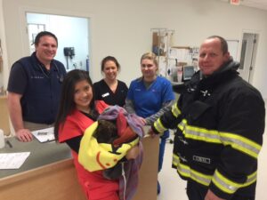 Piper surrounded by warmth and smiles at Clarksville Veterinary Hospital.