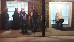 Crumley's supporters try to catch a glimpse of the proceedings through closed blinds. They waited outside in the cold for two hours while council met in executive session. Crumley's supporters try to catch a glimpse of the proceedings through closed blinds. They waited outside in the cold for two hours while council met in executive session.