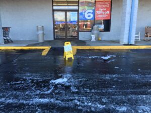 Slippery ice and slush formed outside the store after water ran into the parking lot.