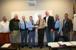 GSP Trooper 1st Class Chase Green receives the 2015 ADTF Interdiction Award from White County Sheriff Neal Walden.