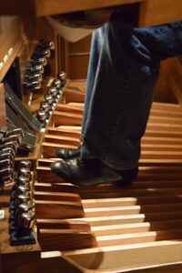 The organ requires certain shoes to press the pedals. This also gives the organist a more professional look.