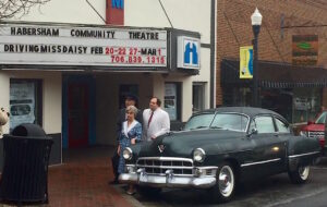 The HCT cast of Driving Miss Daisy poses with the Friedman's car. The car was driven by Morgan Freeman and Dan Akroyd in the 1989 film. It was the car of the title character's son, Boolie.