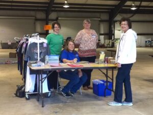 Sale owner Sony Hurt (seated) is working with volunteers getting ready for the sale. The Children's Sale opens to the public on Friday, March 27 at 9am. Pictured (l-r): Amanda Reepe of Demorest, Sonya Hurt, Stacey Kastner of Demorest and Kay Allen of Toccoa.