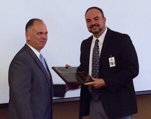 The Habersham County School System was recognized for posting the greatest increase in year to year giving. Here, HABCO United Way President Jim Weidner presents an award to school superintendent Matthew Cooper.