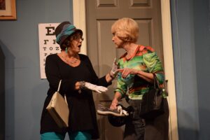 Jan Hames (Mildred) and Alta Mosely (Myrtle) visit the doctor in "A Biddy Full Day".