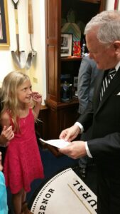 8 year old Ava Fowler of Clarkesville gives Gov. Deal a homemade card thanking him for signing the cannabis oil bill. Ava suffers from seizures. She and her mom spent many long hours at the State Capitol lobbying for the bill's passage.