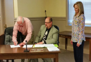 Cornelia Mayor James Irby, City Manager Donald Anderson and Housing Authority Executive Dir Angela Cothran