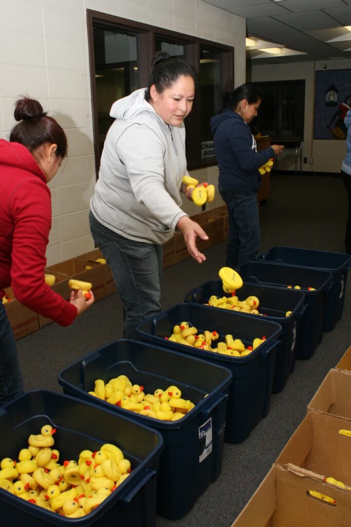 Lorena Duran, center, tosses a rubber duck into a bin as she helps sort more than 2000 ducks. She, along with Maria Herrera, left, and Maria Jeronimo, right, were helping Volunteers for Literacy prepare for their 4th annual rubber duck race to be held May 16th in conjunction with Clarkesville's Mountain Laurel Festival. Not pictured is Silvia Moran. The duck sorters are ESL students. Volunteers for Literacy is a local non-profit United Way Agency promoting literacy initiatives in Habersham County.