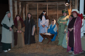 A live nativity scene illustrated the story of Jesus' birth while choir members sang about it.