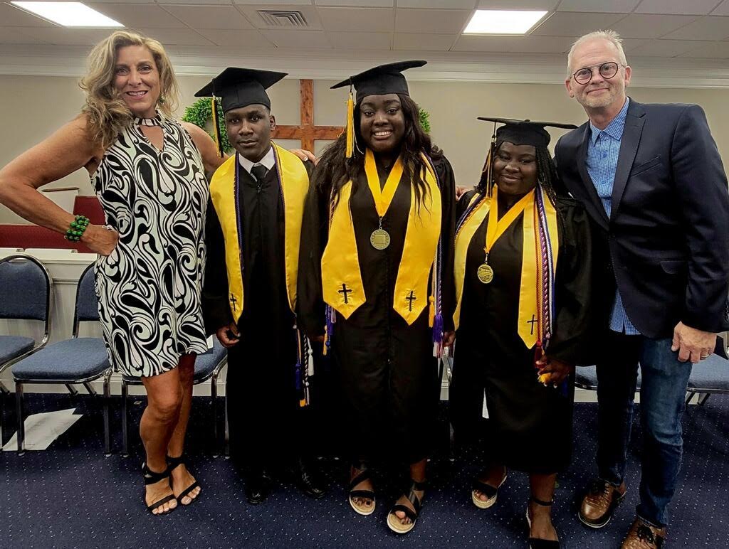 Half-sisters and Haitian earthquake survivors will graduate with first class honors in Hartwell, Georgia